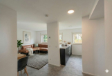 Wohnbereich_gestaged - Modernisierte 2-Zimmer-Wohnung mit Tiefgarage in Liederbach am Taunus